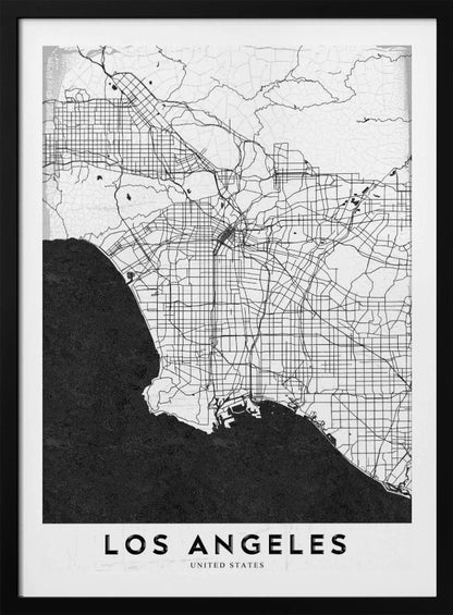 A minimalist black and white framed poster of a street map of Los Angeles. The land is white with an intricate grid of black lines representing roads and highways, while the Pacific Ocean is a solid, textured black. A white band at the bottom contains the city's name, 'LOS ANGELES', in a bold, black sans-serif font. Decor