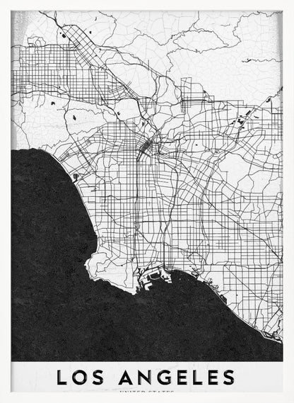 A minimalist black and white framed poster of a street map of Los Angeles. The land is white with an intricate grid of black lines representing roads and highways, while the Pacific Ocean is a solid, textured black. A white band at the bottom contains the city's name, 'LOS ANGELES', in a bold, black sans-serif font. Decor