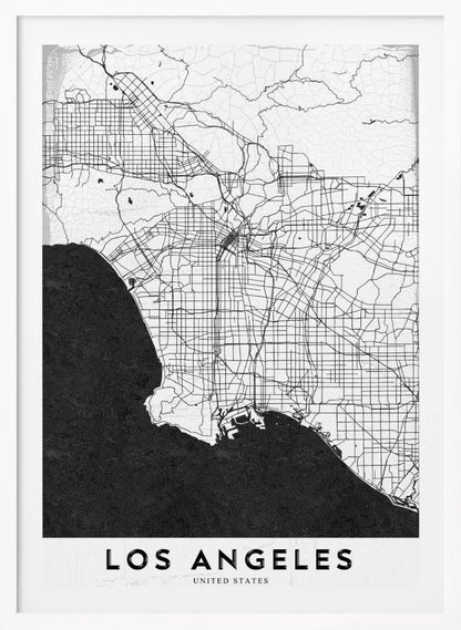 A minimalist black and white framed poster of a street map of Los Angeles. The land is white with an intricate grid of black lines representing roads and highways, while the Pacific Ocean is a solid, textured black. A white band at the bottom contains the city's name, 'LOS ANGELES', in a bold, black sans-serif font. Decor