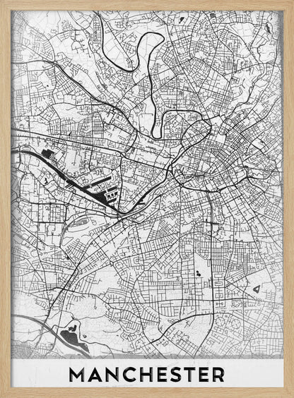 A minimalist black and white street map of Manchester, UK, displayed in a simple black frame. The map details the intricate network of roads and waterways, with the city's name 'MANCHESTER' printed in a bold, modern font at the bottom. Wall Art