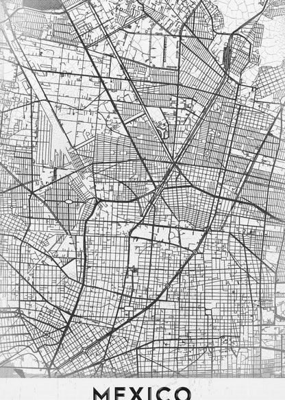 A modern, minimalist black and white art print of a street map of Mexico City, enclosed in a simple black frame. The intricate road network is depicted with black lines on a textured white background. The word 'MEXICO' is printed in bold, black capital letters at the bottom. Print