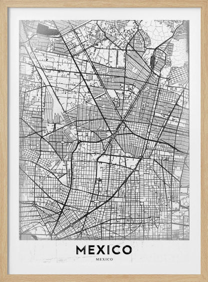 A modern, minimalist black and white art print of a street map of Mexico City, enclosed in a simple black frame. The intricate road network is depicted with black lines on a textured white background. The word 'MEXICO' is printed in bold, black capital letters at the bottom. Print