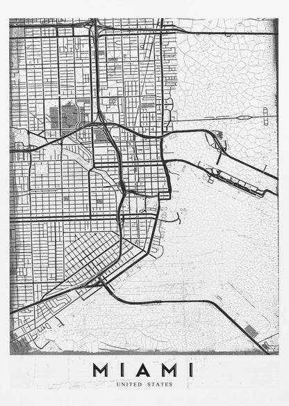 A minimalist black and white street map of Miami, Florida, with a distressed, textured background. The map is framed in black with the word 'MIAMI' printed in bold capital letters at the bottom. Artwork