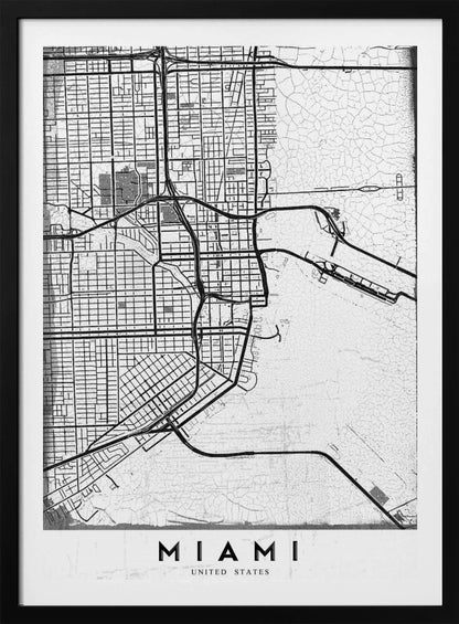 A minimalist black and white street map of Miami, Florida, with a distressed, textured background. The map is framed in black with the word 'MIAMI' printed in bold capital letters at the bottom. Artwork