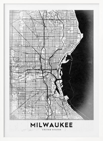 A minimalist, black and white street map of Milwaukee, displayed in a black frame. The map details the city's grid system, major roads, and waterways against a textured background, with the word 'MILWAUKEE' in a bold, sans-serif font at the bottom. Poster