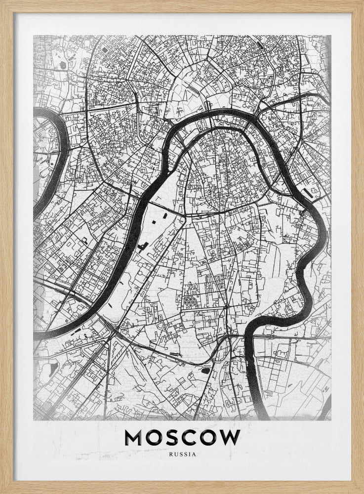 A framed, minimalist black and white street map of Moscow, Russia. The map details the intricate road network and the winding Moskva River. The word 'MOSCOW' is printed in large, black capital letters at the bottom. Print