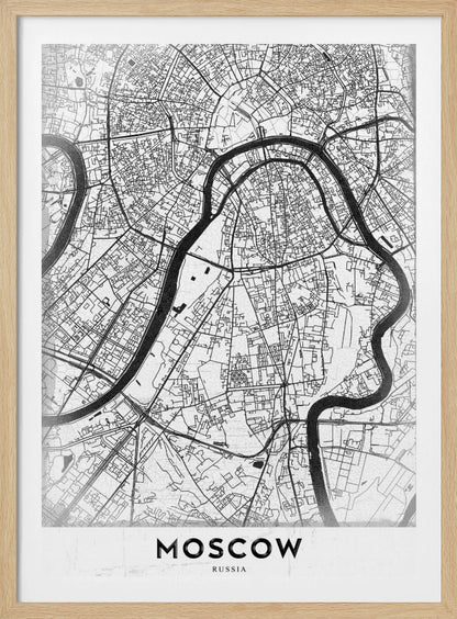 A framed, minimalist black and white street map of Moscow, Russia. The map details the intricate road network and the winding Moskva River. The word 'MOSCOW' is printed in large, black capital letters at the bottom. Print