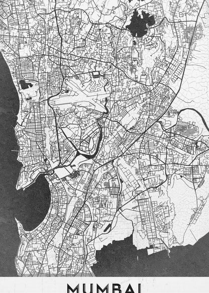 A minimalist black and white framed map of Mumbai. The city's intricate road network is depicted in black lines on a white background, with surrounding water bodies shown in a textured dark grey. The name 'MUMBAI' is in bold, uppercase letters at the bottom. Print