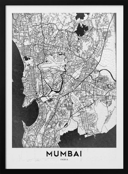 A minimalist black and white framed map of Mumbai. The city's intricate road network is depicted in black lines on a white background, with surrounding water bodies shown in a textured dark grey. The name 'MUMBAI' is in bold, uppercase letters at the bottom. Print