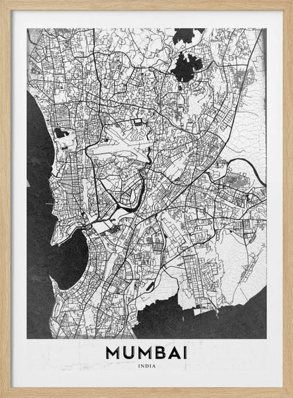 A minimalist black and white framed map of Mumbai. The city's intricate road network is depicted in black lines on a white background, with surrounding water bodies shown in a textured dark grey. The name 'MUMBAI' is in bold, uppercase letters at the bottom. Print