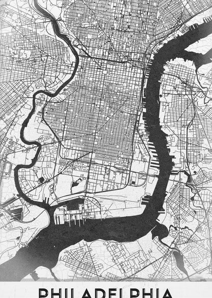 A modern black and white framed poster of a city map of Philadelphia. The map details the street grid, with the Schuylkill and Delaware rivers prominently featured in solid black. The word 'PHILADELPHIA' is printed in a bold, black sans-serif font at the bottom. Artwork