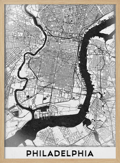 A modern black and white framed poster of a city map of Philadelphia. The map details the street grid, with the Schuylkill and Delaware rivers prominently featured in solid black. The word 'PHILADELPHIA' is printed in a bold, black sans-serif font at the bottom. Artwork