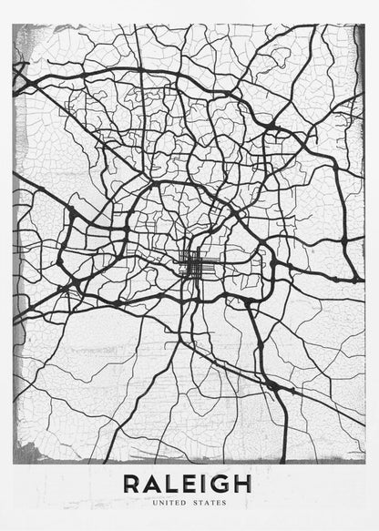 A minimalist black and white street map of Raleigh, North Carolina, displayed in a black frame. The map features black lines representing roads on a distressed, crackled white background. At the bottom, the word 'RALEIGH' is printed in a bold, black, sans-serif font. Print
