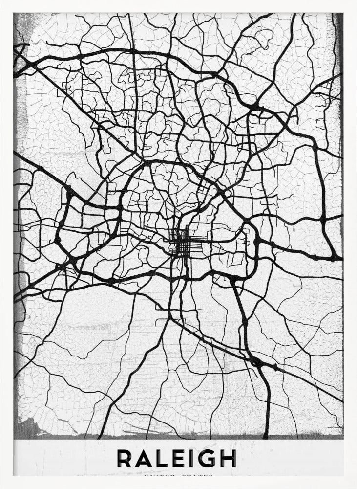 A minimalist black and white street map of Raleigh, North Carolina, displayed in a black frame. The map features black lines representing roads on a distressed, crackled white background. At the bottom, the word 'RALEIGH' is printed in a bold, black, sans-serif font. Print