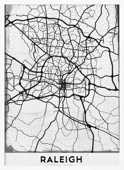 A minimalist black and white street map of Raleigh, North Carolina, displayed in a black frame. The map features black lines representing roads on a distressed, crackled white background. At the bottom, the word 'RALEIGH' is printed in a bold, black, sans-serif font. Print