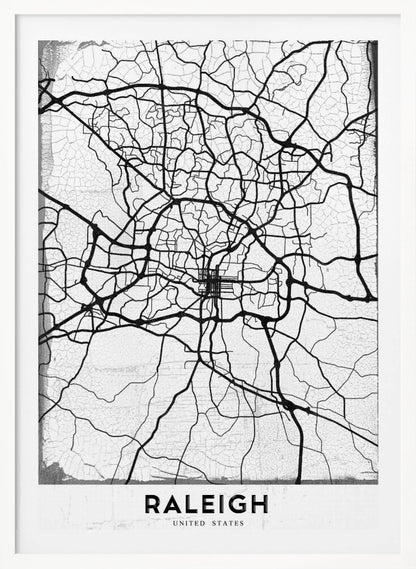 A minimalist black and white street map of Raleigh, North Carolina, displayed in a black frame. The map features black lines representing roads on a distressed, crackled white background. At the bottom, the word 'RALEIGH' is printed in a bold, black, sans-serif font. Print