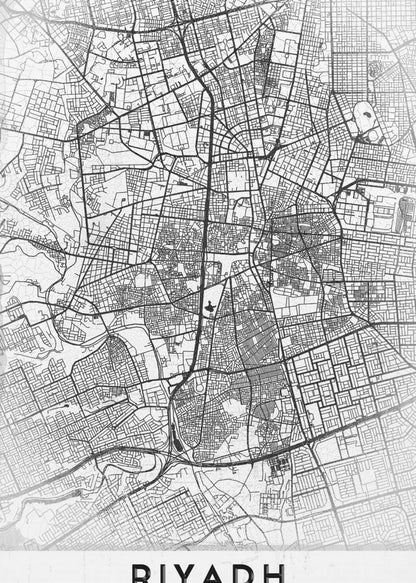 A minimalist, black and white framed poster of a city map of Riyadh. The map details the intricate network of streets and city blocks in black lines on a textured, light gray background. At the bottom, the word 'RIYADH' is printed in a bold, black, sans-serif font. Wall Art
