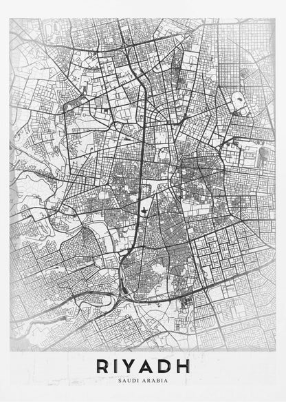 A minimalist, black and white framed poster of a city map of Riyadh. The map details the intricate network of streets and city blocks in black lines on a textured, light gray background. At the bottom, the word 'RIYADH' is printed in a bold, black, sans-serif font. Wall Art