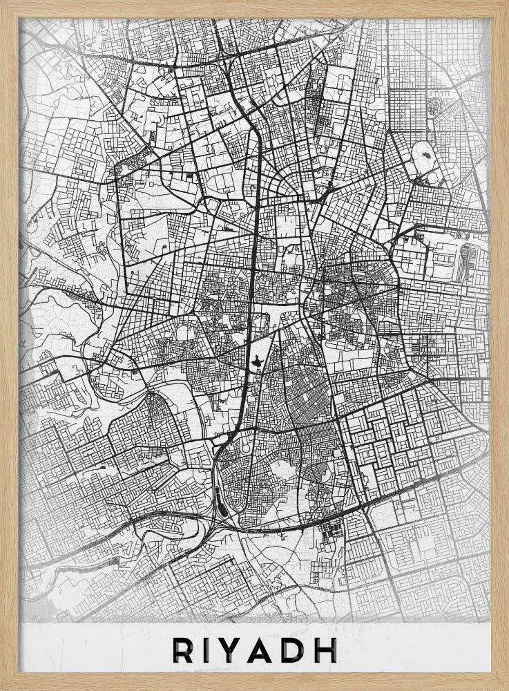 A minimalist, black and white framed poster of a city map of Riyadh. The map details the intricate network of streets and city blocks in black lines on a textured, light gray background. At the bottom, the word 'RIYADH' is printed in a bold, black, sans-serif font. Wall Art