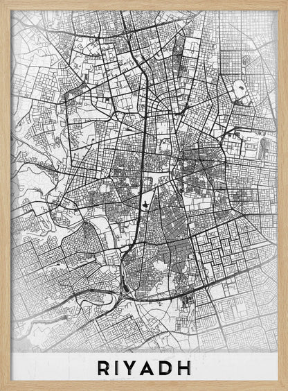 A minimalist, black and white framed poster of a city map of Riyadh. The map details the intricate network of streets and city blocks in black lines on a textured, light gray background. At the bottom, the word 'RIYADH' is printed in a bold, black, sans-serif font. Wall Art