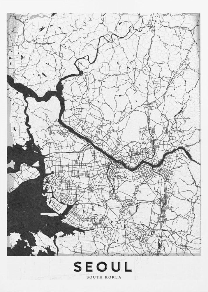 A minimalist black and white map of Seoul, South Korea, showing the city's intricate network of roads and the Han River. The map is presented in a modern, artistic style with a simple black frame and the word 'SEOUL' in bold capital letters at the bottom. Decor