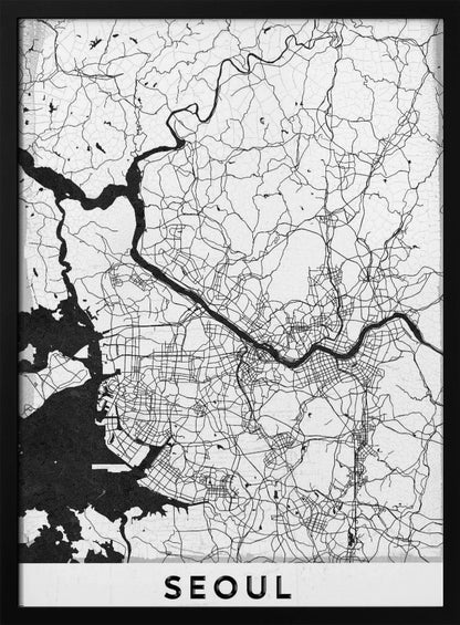 A minimalist black and white map of Seoul, South Korea, showing the city's intricate network of roads and the Han River. The map is presented in a modern, artistic style with a simple black frame and the word 'SEOUL' in bold capital letters at the bottom. Decor