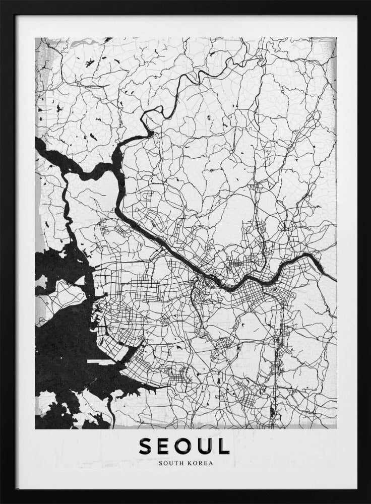 A minimalist black and white map of Seoul, South Korea, showing the city's intricate network of roads and the Han River. The map is presented in a modern, artistic style with a simple black frame and the word 'SEOUL' in bold capital letters at the bottom. Decor