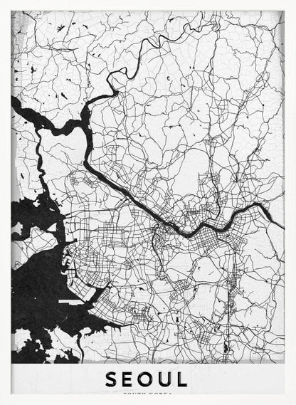 A minimalist black and white map of Seoul, South Korea, showing the city's intricate network of roads and the Han River. The map is presented in a modern, artistic style with a simple black frame and the word 'SEOUL' in bold capital letters at the bottom. Decor