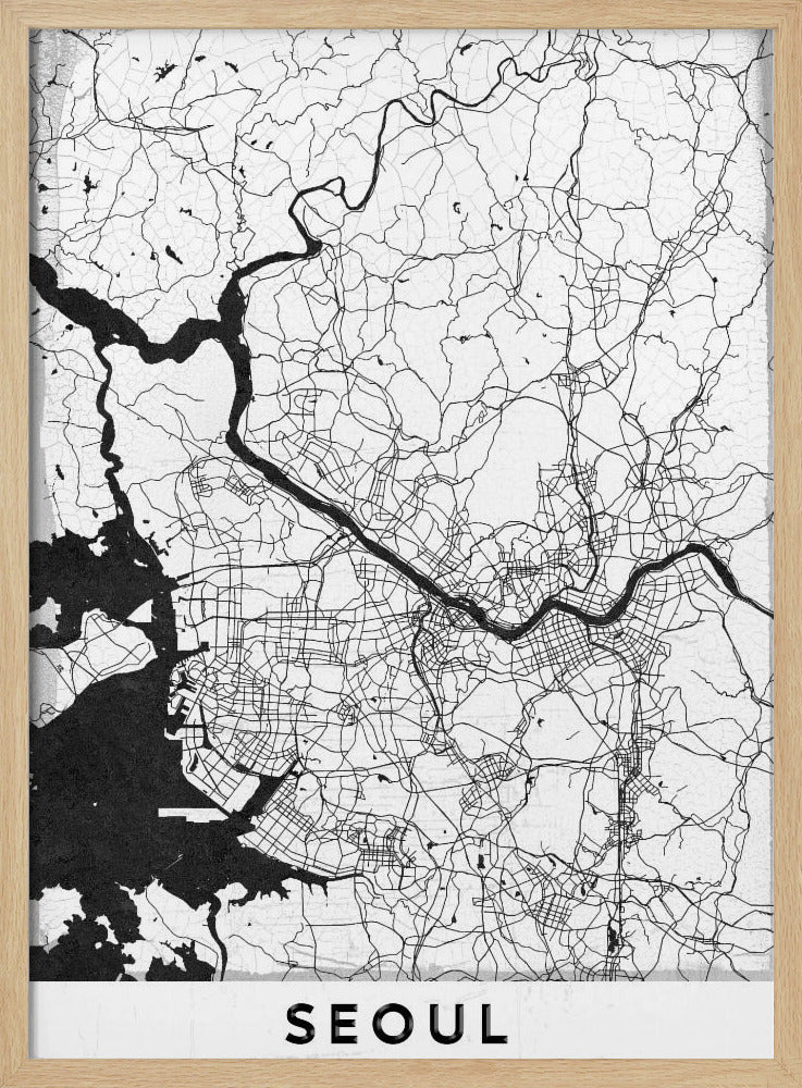 A minimalist black and white map of Seoul, South Korea, showing the city's intricate network of roads and the Han River. The map is presented in a modern, artistic style with a simple black frame and the word 'SEOUL' in bold capital letters at the bottom. Decor