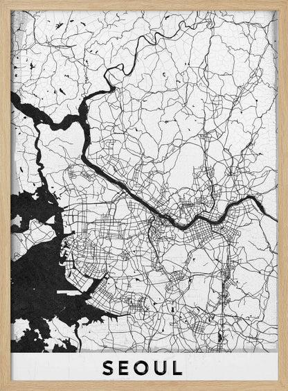 A minimalist black and white map of Seoul, South Korea, showing the city's intricate network of roads and the Han River. The map is presented in a modern, artistic style with a simple black frame and the word 'SEOUL' in bold capital letters at the bottom. Decor