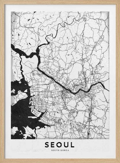 A minimalist black and white map of Seoul, South Korea, showing the city's intricate network of roads and the Han River. The map is presented in a modern, artistic style with a simple black frame and the word 'SEOUL' in bold capital letters at the bottom. Decor
