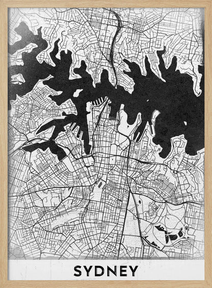 A modern black and white framed art print of a city map of Sydney, Australia. The water bodies are shown in solid textured black, while the land is depicted with a detailed white street grid. At the bottom, the word 'SYDNEY' is printed in bold capital letters. Poster