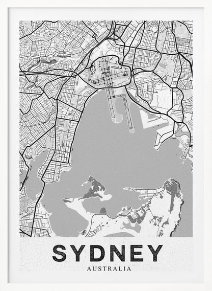 A modern, black and white framed art print of a stylized map of Sydney, Australia. The map features bold black lines for the street grid and major roads, with light grey for the landmass and a darker grey for the water of the harbor. The word 'SYDNEY' is printed in large, black, sans-serif font at the bottom of the poster. Poster