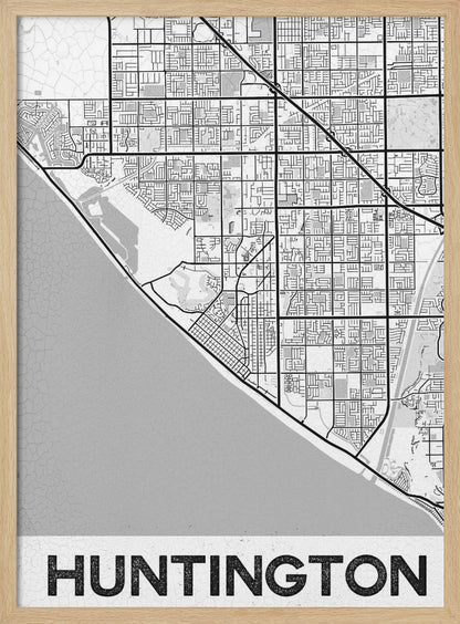 A minimalist black and white framed map of Huntington. The map details the city's street grid next to the coastline, with the name 'HUNTINGTON' printed in bold block letters at the bottom. Print