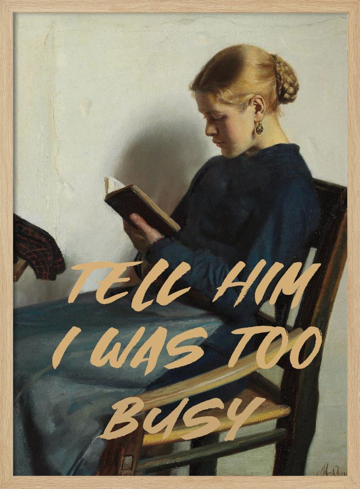 A classical painting of a woman in a blue dress sitting in a wooden chair, engrossed in reading a book. Overlaid in a modern, tan-colored brush script font is the phrase 'TELL HIM I WAS TOO BUSY'. Wall Art