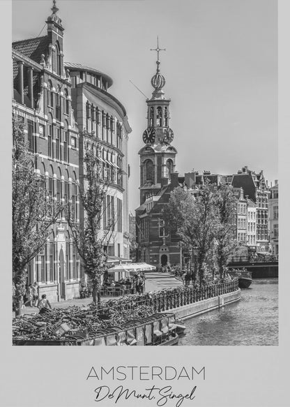 A black and white travel poster of Amsterdam, Netherlands. The photo shows the Munttoren clock tower and traditional Dutch buildings along the Singel canal. A floating barge filled with bicycles is in the foreground. The poster has a white border with the text 'AMSTERDAM', 'De Munt, Singel', and 'NEDERLAND' at the bottom. Artwork