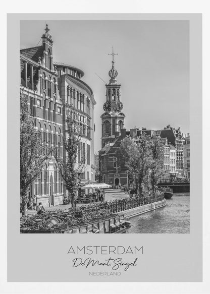 A black and white travel poster of Amsterdam, Netherlands. The photo shows the Munttoren clock tower and traditional Dutch buildings along the Singel canal. A floating barge filled with bicycles is in the foreground. The poster has a white border with the text 'AMSTERDAM', 'De Munt, Singel', and 'NEDERLAND' at the bottom. Artwork