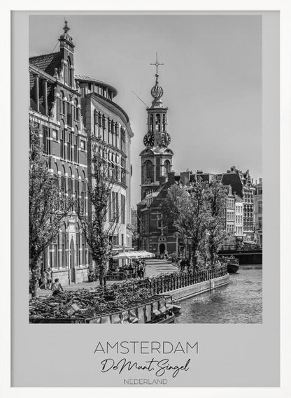 A black and white travel poster of Amsterdam, Netherlands. The photo shows the Munttoren clock tower and traditional Dutch buildings along the Singel canal. A floating barge filled with bicycles is in the foreground. The poster has a white border with the text 'AMSTERDAM', 'De Munt, Singel', and 'NEDERLAND' at the bottom. Artwork