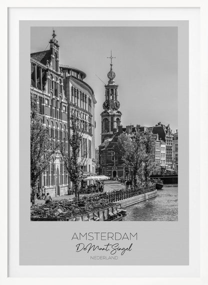 A black and white travel poster of Amsterdam, Netherlands. The photo shows the Munttoren clock tower and traditional Dutch buildings along the Singel canal. A floating barge filled with bicycles is in the foreground. The poster has a white border with the text 'AMSTERDAM', 'De Munt, Singel', and 'NEDERLAND' at the bottom. Artwork