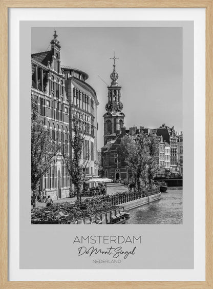 A black and white travel poster of Amsterdam, Netherlands. The photo shows the Munttoren clock tower and traditional Dutch buildings along the Singel canal. A floating barge filled with bicycles is in the foreground. The poster has a white border with the text 'AMSTERDAM', 'De Munt, Singel', and 'NEDERLAND' at the bottom. Artwork