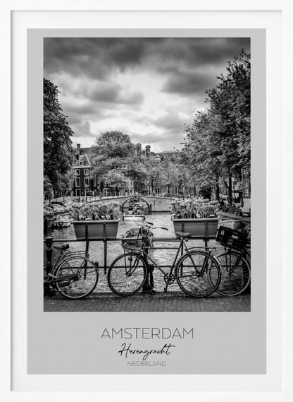 A black and white poster of the Herengracht canal in Amsterdam. In the foreground, two bicycles are parked by a railing with flower boxes. In the background, there's a classic view of the canal with a bridge, canal houses, and boats under a cloudy sky. The bottom of the poster has text that reads 'AMSTERDAM Herengracht NEDERLAND'. Decor