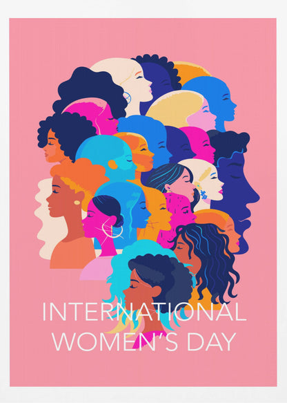 A vibrant poster for International Women's Day featuring a pink background. The central graphic is a collage of colorful profiles of diverse women, representing different ethnicities and hairstyles, all looking in the same direction. Below the illustration, white text reads 'INTERNATIONAL WOMEN'S DAY'. Wall Art