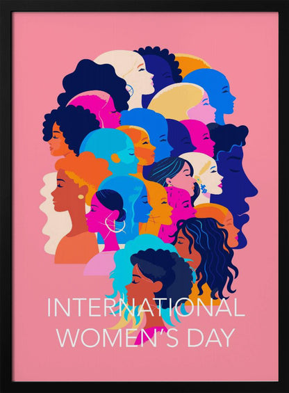 A vibrant poster for International Women's Day featuring a pink background. The central graphic is a collage of colorful profiles of diverse women, representing different ethnicities and hairstyles, all looking in the same direction. Below the illustration, white text reads 'INTERNATIONAL WOMEN'S DAY'. Wall Art