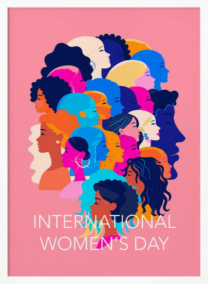 A vibrant poster for International Women's Day featuring a pink background. The central graphic is a collage of colorful profiles of diverse women, representing different ethnicities and hairstyles, all looking in the same direction. Below the illustration, white text reads 'INTERNATIONAL WOMEN'S DAY'. Wall Art