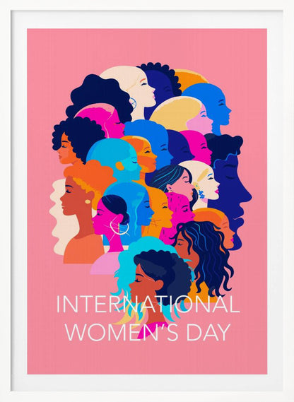 A vibrant poster for International Women's Day featuring a pink background. The central graphic is a collage of colorful profiles of diverse women, representing different ethnicities and hairstyles, all looking in the same direction. Below the illustration, white text reads 'INTERNATIONAL WOMEN'S DAY'. Wall Art