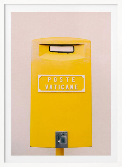 A close-up, front-view photograph of a vibrant yellow Vatican City mailbox against a plain beige wall, enclosed in a thin black frame. The words 'POSTE VATICANE' are printed in white on the front. Artwork