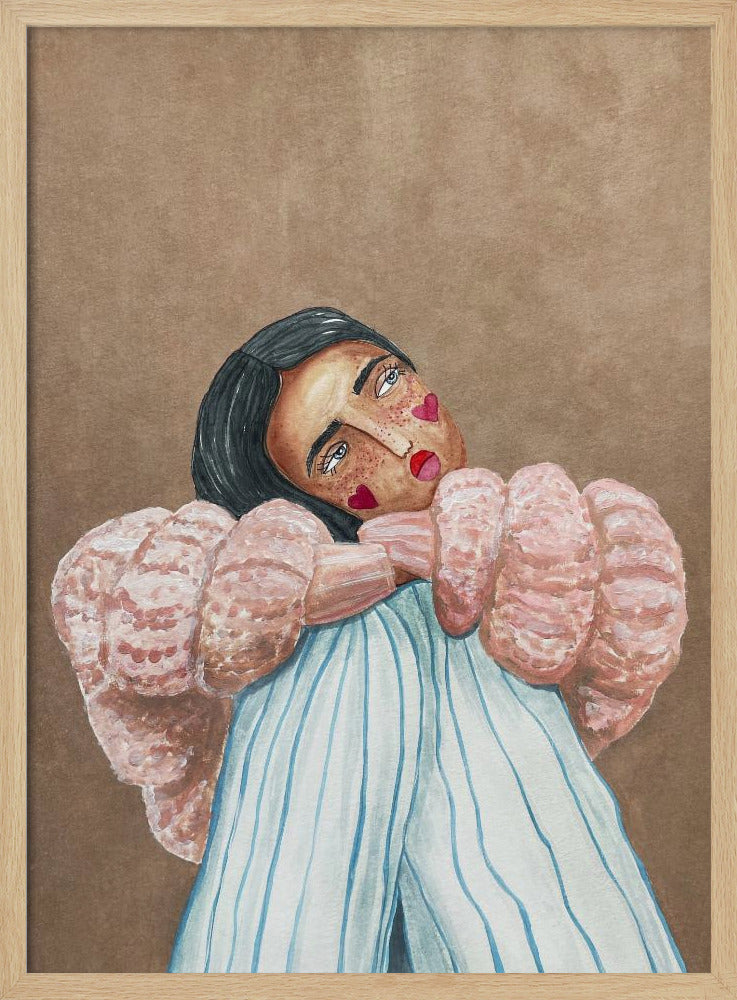 An illustrative painting of a person with dark hair, freckles, and red heart stickers on their cheeks. They are wearing a textured pink sweater and light blue pinstripe pants, hugging their knees while looking at the viewer with their head tilted against a solid brown background. Wall Art