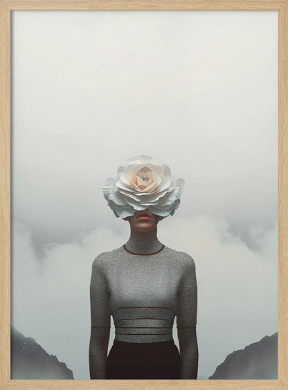 A surrealist portrait of a person from the waist up, their face completely covered by a large, white paper rose. They are wearing a grey turtleneck sweater and stand in front of a foggy, mountainous landscape under a pale grey sky. Poster