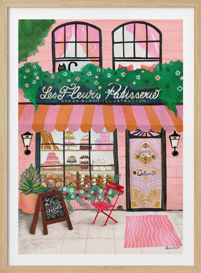 A whimsical illustration of a charming pink French bakery named 'Les Fleurs Patisserie'. A pink and orange striped awning hangs over a window filled with cakes and pastries. A black cat peeks out from a lush green garland above the shop. In front, a small red chair, a chalkboard sign, and an ornate pink door add to the inviting Parisian scene. Print