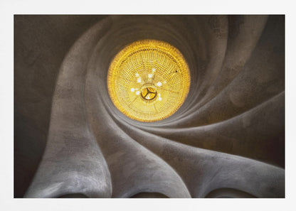 A worm's-eye view of an ornate, golden chandelier set against a swirling, textured dark grey ceiling. The spiraling architectural feature draws the eye to the brightly lit fixture, creating an abstract and dramatic composition. Poster